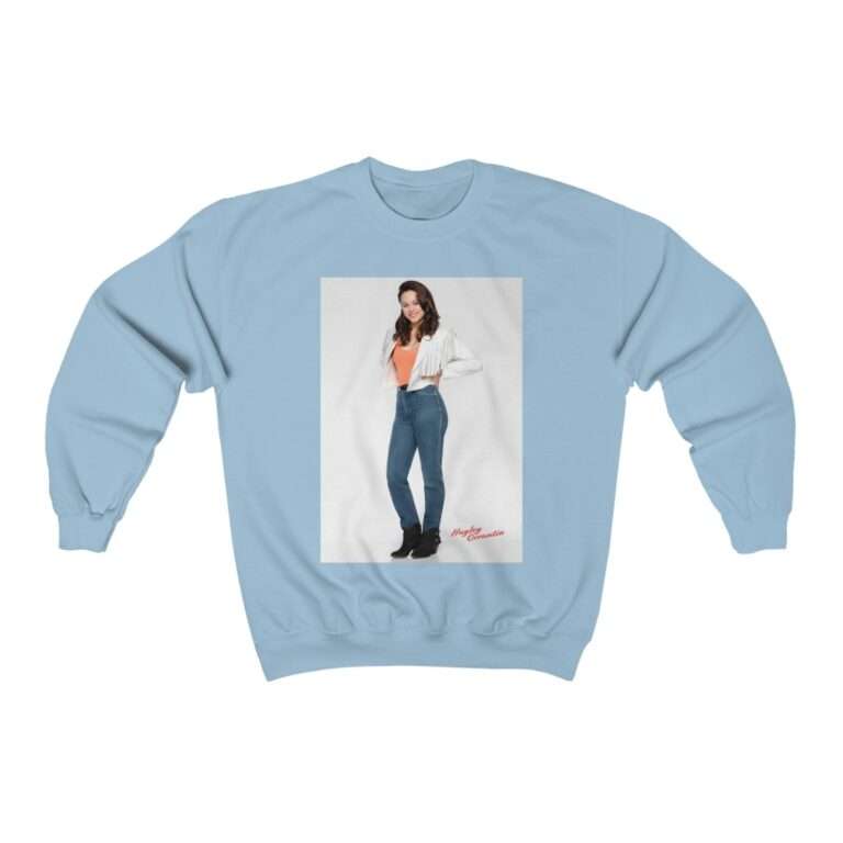 Actress Hayley Orrantia in White Jacket and Orange Top - Sweatshirt - Image 9