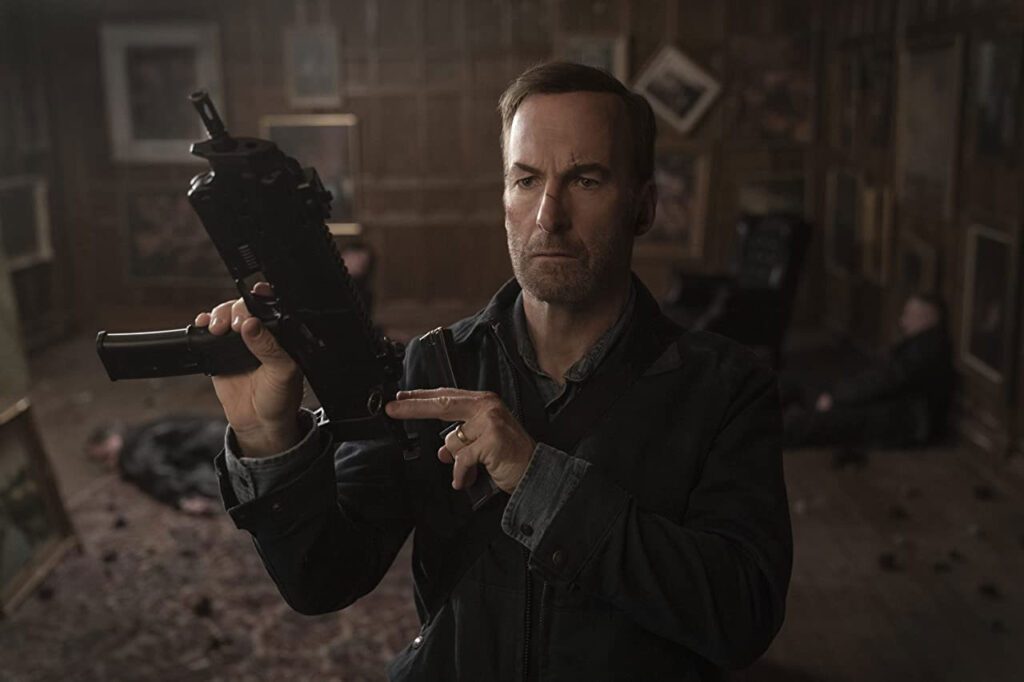 Bob Odenkirk reloading gun at the art room "NOBODY" 2021